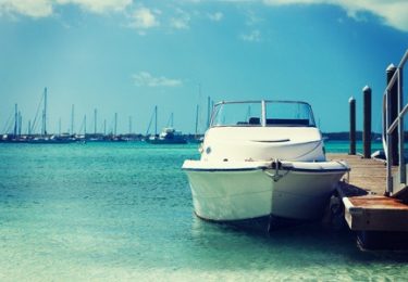 31410666 - vacation, travel and sea concept - white boat at blue sea